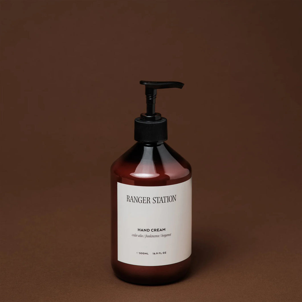 Ranger Station Hand Cream in an amber  bottle with a black pump and a white label reading 