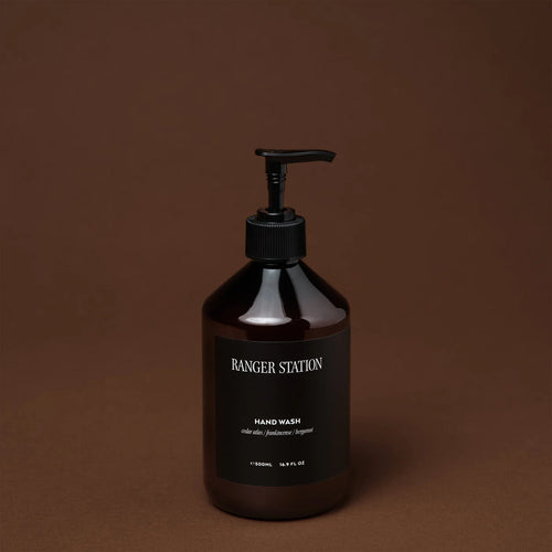 Ranger Station Hand Wash in an amber  bottle with a black pump and a white label reading 