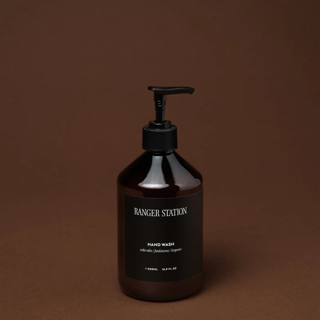 Ranger Station Hand Wash in an amber  bottle with a black pump and a white label reading 