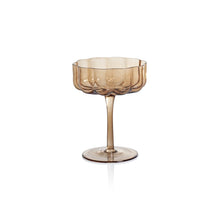 Load image into Gallery viewer, Handblown amber glass coup with a scalloped bowl and slender stem, displayed against a white background. 