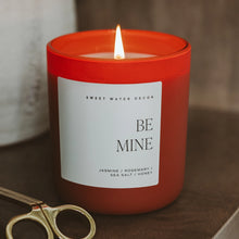 Load image into Gallery viewer, Red candle labeled "Be Mine" with a white label on a dark surface.