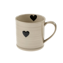 Load image into Gallery viewer, White stoneware mug with a black heart design on the front and inside rim area.