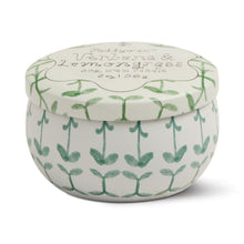 Load image into Gallery viewer, Round mini soy candle tin featuring green botanical design with matching lid, shown closed on a white background.