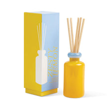Load image into Gallery viewer, Stacked glass reed diffuser in yellow bottle with blue collar and natural reeds, displayed beside matching Zesty Lemon diffuser box on a white background.