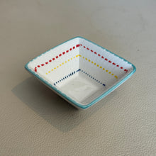 Load image into Gallery viewer, Square stoneware Geo dish with teal rim featuring clean lines and multicolor dashed line detail, shown on a neutral surface. 