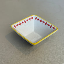 Load image into Gallery viewer, Square stoneware Geo dish with yellow rim featuring clean lines and red cross detail, shown on a neutral surface. 