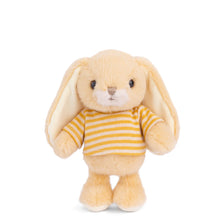 Load image into Gallery viewer, Bouncy Bunny soft yellow plushie with long floppy ears, white muzzle, and yellow and white striped shirt displayed standing on a white background.