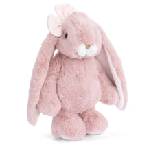 Load image into Gallery viewer, Friendly Kanini soft pink bunny plushie with long floppy ears, white muzzle, small pink nose, and light pink bow on ear displayed on a white background.