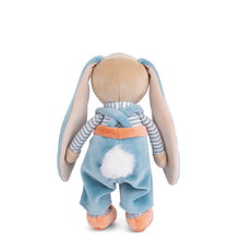 Load image into Gallery viewer, Little Bunny Brothers plush bunny in blue pants with soft fabric body, beige head and hands, long floppy blue ears with beige interiors, blue and white striped turtleneck, blue crisscrossed overalls, round fluffy white tail, and orange shoes, shown from back view, displayed on a white background. 