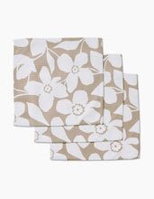 Load image into Gallery viewer, Geometry Luxe washcloths, set of three, featuring white floral pattern on tan, displayed overlapping on a white background.