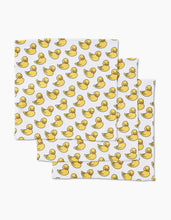 Load image into Gallery viewer, Geometry Luxe washcloths, set of three, featuring yellow duck pattern, displayed overlapping on a white background. 