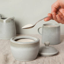 Load image into Gallery viewer, Aquarius Sage stoneware sugar pot with reactive glaze and lid, with spoon and matching pieces.