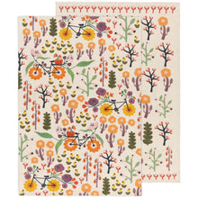 Load image into Gallery viewer, Petal Power cotton linen dishtowel with multicolor floral and bicycle pattern on an ivory background, with a red floral border, overlapping, displayed on a white background. 
