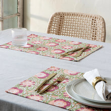 Load image into Gallery viewer, Zinnia block-printed cotton placemats with pink and peach floral and white vine pattern on an olive background, displayed on a table setting.