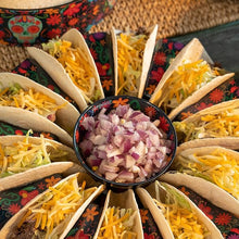 Load image into Gallery viewer, Day of the Dead Taco Prep Bowl, black melamine bowl with colorful floral interior design, filled with diced red onions and displayed in center of coordinating taco carousel with cheese, lettuce, and meat tacos. 