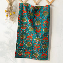 Load image into Gallery viewer, Allure Block Print Dishtowel, cotton towel with hand block-printed floral pattern in coral and olive on a teal background, displayed hanging against a white background. 