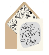 Load image into Gallery viewer, Happy Father's Day Card, cream greeting card with black script text on gray center panel, beige envelope with black and white specialized dad graphics liner, displayed on white background. 