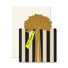 Load image into Gallery viewer, Happy Birthday Present Card, present-shaped greeting card with illustrated black and cream vertical striped gift wrap design, oversized gold bow and ribbon, yellow Happy Birthday tag, and matching ivory envelope, displayed on white background. 
