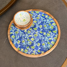 Load image into Gallery viewer, Azure &amp; Ivy round platter and bowl set with blue and green botanical design, bowl with white interior featuring blue vines and green rose accents, with mango wood rims, displayed on a dark textured surface. 