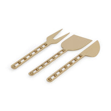 Load image into Gallery viewer, Zodax Córdoba cheese knife set of three in gold-tone stainless steel, including fork, flat blade, and curved knife, with beaded handle detail, displayed on white background.  