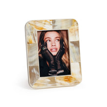Load image into Gallery viewer, Zodax Dune African white horn photo frame with marbled cream, ivory, and amber tones in a geometric inlay, displayed with inset portrait on white background.  