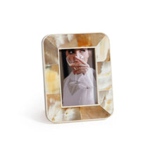 Load image into Gallery viewer, Zodax Dune African white horn photo frame with marbled cream, ivory, and amber tones in a geometric inlay, displayed with inset portrait on white background. 