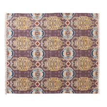 Load image into Gallery viewer, Tibetan Tigers Cotton Slub Printed Throw, horizontal full view of plum printed throw blanket with repeating golden honey and dark brown tiger motifs, teal and beige geometric accents with fringe ends, against white background. 