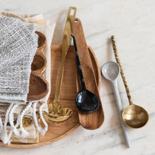 Load image into Gallery viewer, Horn Spoons Set, dark natural horn spoon displayed on wooden tray beside assorted decorative spoons and folded tasseled textiles on light marble surface. 