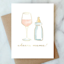 Load image into Gallery viewer, Cheers Mama Card, hand-painted watercolor illustration of wine glass with blush wine and baby bottle, gold foil script text, recycled brown kraft envelope behind, on white marble surface. 