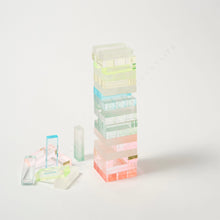 Load image into Gallery viewer, Ombré Lucite Tumbling Tower Game, translucent lucite stacking blocks in pastel ombré colors with additional pieces scattered beside tower, on white background. 