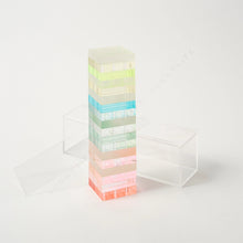 Load image into Gallery viewer, Ombré Lucite Tumbling Tower Game, translucent lucite stacking blocks in pastel ombré colors with clear lucite display case beside, on white background. 