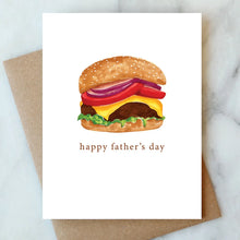Load image into Gallery viewer, Hamburger Happy Father's Day Card, watercolor-style cheeseburger illustration printed on white textured felt cardstock with brown kraft envelope on white marble surface.