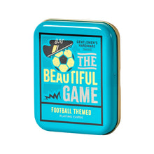 Load image into Gallery viewer, Football Themed Playing Cards, turquoise and gold playing card tin with soccer ball and cleat graphics and "THE BEAUTIFUL GAME" lettering against a white background. 