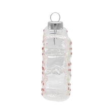 Load image into Gallery viewer, Smarties Candy Ornament, side view of a clear glass ornament with red glitter dots decorating both sides and silver-tone hanging cap, against a white background. 