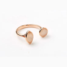 Load image into Gallery viewer, Rose Gold Cat's Eye Open Ring, handcrafted open-design rose gold-tone ring with round and marquise-shaped blush pink cat's eye bezel-set stones against a white background. 