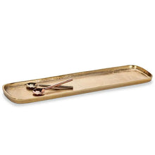 Load image into Gallery viewer, Large Gold Oval Tray, large lightweight oval tray with a warm burnished gold finish, raised rim, and rounded corners, shown with gold-tone and rose gold-tone spoons, against a white background. 