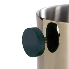 Load image into Gallery viewer, Up-close of a metal gold finish ice bucket with a round dark green handle displayed against a white background.