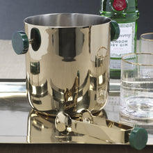 Load image into Gallery viewer, Gold finish ice bucket with round dark green resin handles next to gold finish ice tongs with a round dark green resin knob on the end.  On a reflective metal tray with a glass tumbler with a gold rim. Green bottle of Dry Gin and a glass tumbler with a gold rim behind the ice bucket. Displayed on a white surface and against a dark wall. 