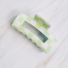 Load image into Gallery viewer, Checker Lovers Hair Claw | 5 Styles, rectangular hair claw clip with a cutout center, featuring a white and pale green checkerboard pattern, displayed on a white background.   
