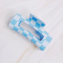 Load image into Gallery viewer, Checker Lovers Hair Claw | 5 Styles, rectangular hair claw clip with a cutout center, featuring a white and blue checkerboard pattern, displayed on a white background. 