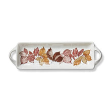 Load image into Gallery viewer, White handled serving tray with a gold, red, and brown leaf print in the center. White background. 