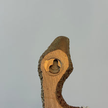 Load image into Gallery viewer, Gold Resin Snake Wall Décor, close-up of the flat back of the gold snake with a  recessed keyhole hanging slot against a white background.