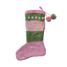 Load image into Gallery viewer, Crocheted Christmas stocking in pink, green, brown, and white yarn with a pink  hanging loop and two pom-poms - one solid pink and one multi-colored- at the top. Displayed against a white background.   