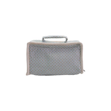 Load image into Gallery viewer, Closed light blue fabric suitcase with small red polka dots, a matching fabric handle, and cream trim, displayed on white background. 