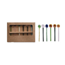 Load image into Gallery viewer, Set of six colorful glass spoons next to a set of six colorful spoons in a brown  packaging box, on a white background. 