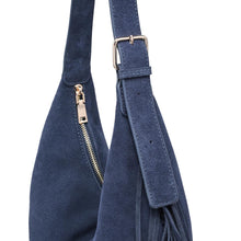 Load image into Gallery viewer, Midnight Reba Hobo, close-up of the navy blue suede shoulder strap with stitched edges, adjustment holes, a rectangular metal buckle, and a matching strap keeper beside the bag’s metal top zipper and side fringe, against a white background.